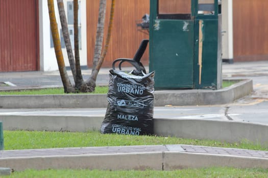LIMA, PERU - November, 2019: Garbage waiting to be picked up by the garbage truck.