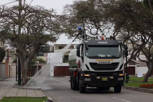 Water truck in the city park in Lima, Peru.