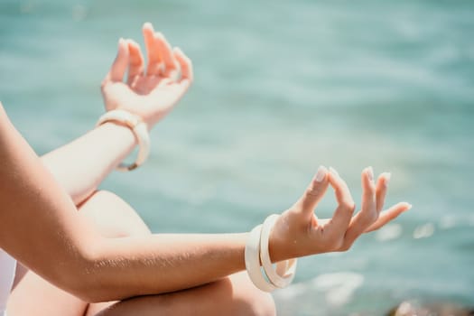 Close up Hand Gesture of Woman Doing an Outdoor Lotus Yoga Position. Close up. Blurred background