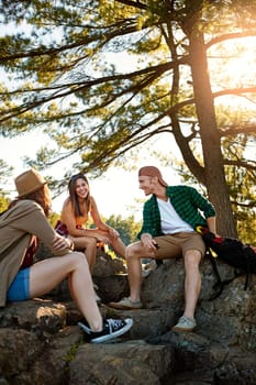 Its a friendship filled with sunshine and smiles. three young people hiking while on an overseas trip