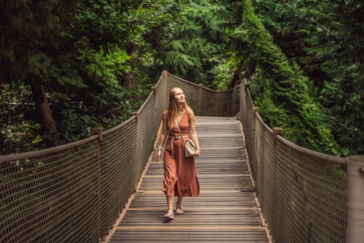 Woman tourist in Rope bridge in Yildiz Park. Besiktas, Istanbul, Turkey. Turkiye.