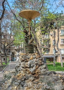 Odessa, Ukraine 15.04.2023. Fountain in the City square Palais Royal in Odessa, Ukraine, on a sunny spring day