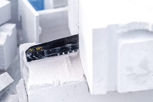 cutting concrete blocks with a saw during the construction of a building wall.