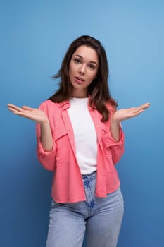 charming informal brunette woman with hair below her shoulders posing as a model.