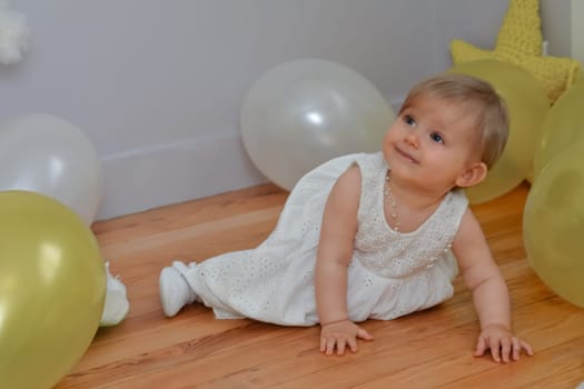 Birthday toddler girl with balloons