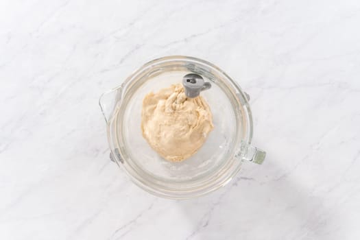 Flat lay. Mixing bread dough in a stand-alone kitchen mixer to bake patriotic cinnamon twists.