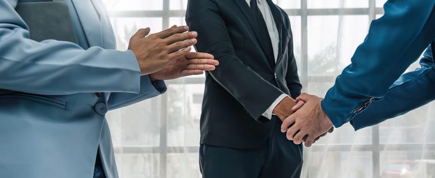 Business handshake for teamwork of business merger and acquisition,successful negotiate,hand shake,two businessman shake hand with partner to celebration partnership and business deal concept