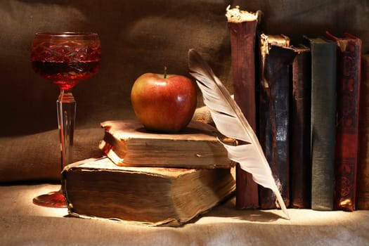 Nice vintage still life with wine glass and old books