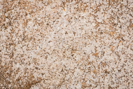Detail of the marble wall texture, close-up of the rock surface.
