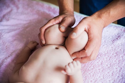 a doing massage for foot little baby