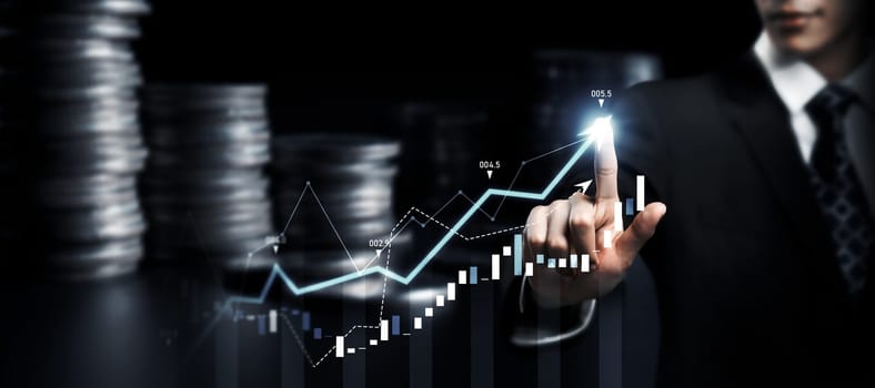 Businessman analyst working with digital finance business data graph showing technology of investment strategy for perceptive financial business decision. Digital economic analysis technology concept.