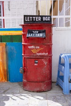Leh, India - April 2, 2023: A red letter box from the India Post at the post office in the main market