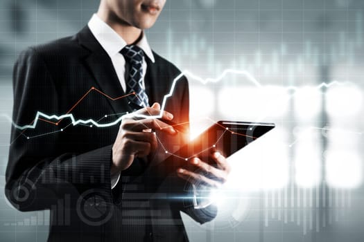 Businessman analyst working with digital finance business data graph showing technology of investment strategy for perceptive financial business decision. Digital economic analysis technology concept.