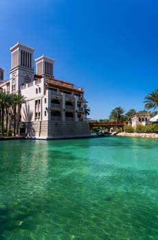 Waterway with old wooden bridge in the Souk Madinat Junction mall