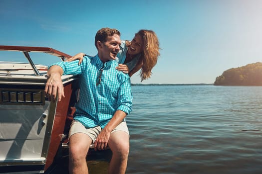 Taking romance out to sea. a young couple spending time together on a yacht