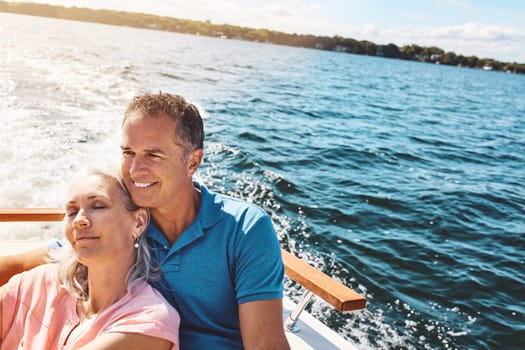 Romance out at sea. a mature couple enjoying a relaxing boat ride