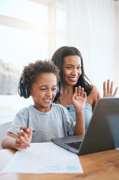 Laptop, video call and mother with child learning, online education and school help or support in virtual class. African family and child wave hello on computer, happy for writing or teaching at home.