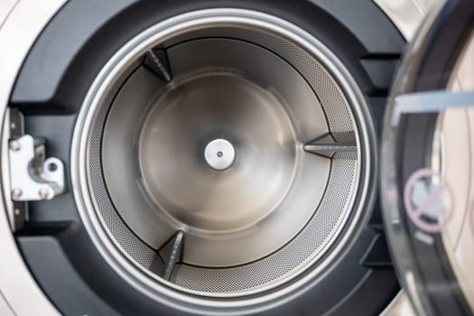 Close up brand new drum material metal electrical household appliance, Inside of washing machine tub is made of stainless steel, Empty inside