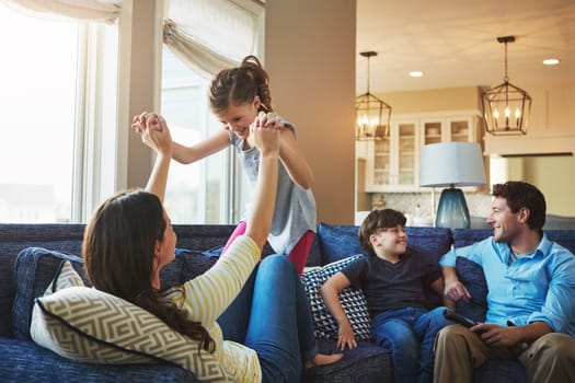 The joys of family life. a happy family bonding together at home