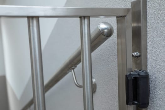 Close-up view of how the railing was made and attached, along with the post and handrail. The enclosure is made of acid-resistant stainless steel.