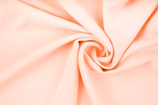 Texture of the satin fabric of beige color for the background