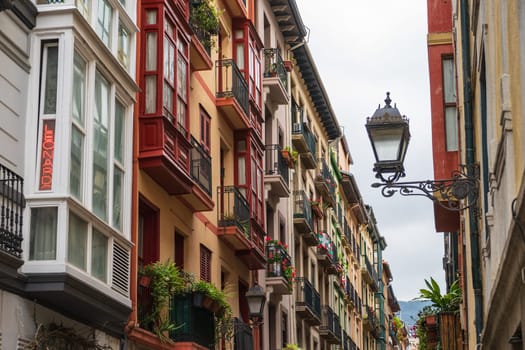 Bilbao, Basque Country, Spain - 11 06 2022: narrow streets with colorful balconies, Bilbao, Spain