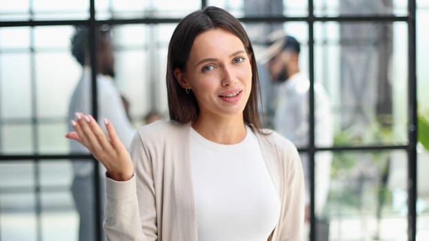 Face of beautiful woman on the background of business people