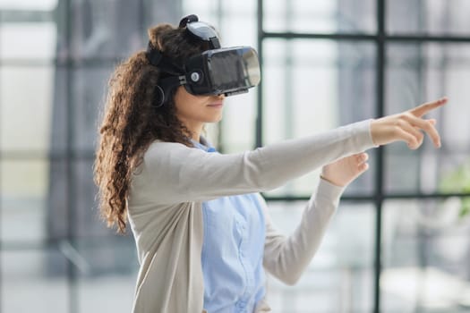 Girl trying to touch objects in virtual reality.