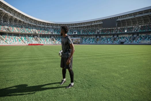 African American soccer player during match inside large stadium