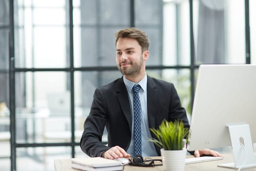 Young businessman working at office