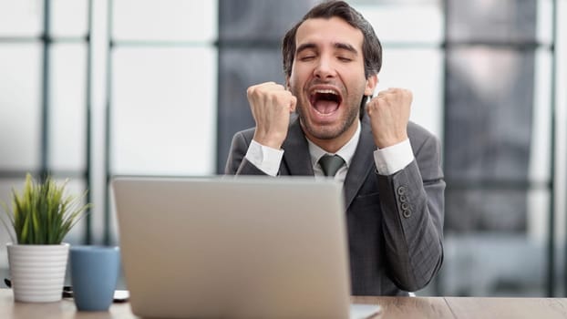 celebrating goal achievement winning online getting good news in email raising hands feeling euphoric.