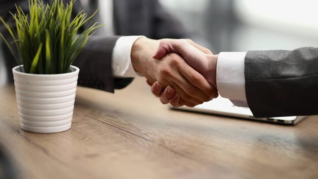 Handshake of two businessmen who enters into the contract