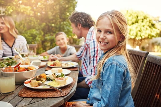 My family is the best ever. a family eating lunch together outdoors