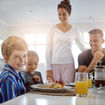 Breakfast is the healthy way to start your day. a family having breakfast together