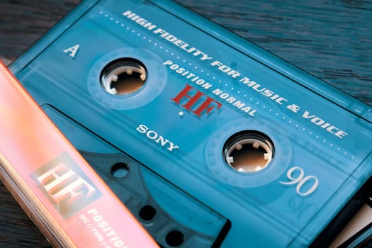 Ryazan, Russia - April 27, 2023: Vintage Sony audio cassette tape on wooden background, close up. Retro music concept. Selective focus