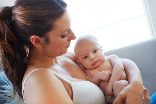 Time out with mom. Closeup shot of a mother holding her newborn baby