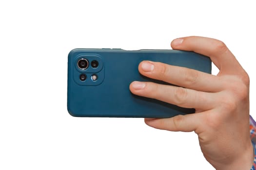 Hand of a man close-up holding a mobile phone or smartphone in a blue case on a white background, isolated.