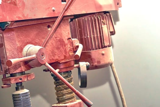 a tool, power tool, or machine with a rotating cutting tip or reciprocating hammer or chisel, used for making holes.