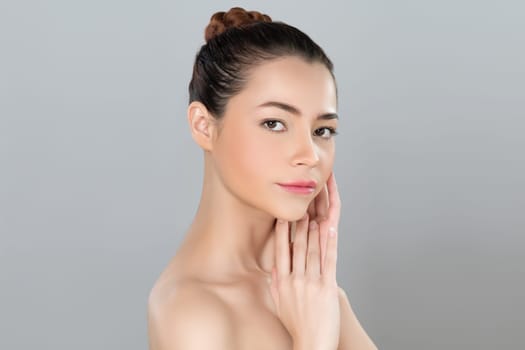 Glamorous woman portrait with perfect smooth pure clean skin with soft cosmetic makeup in isolated background. Beauty hand gesture with expressive facial expression for skincare product or spa ad.