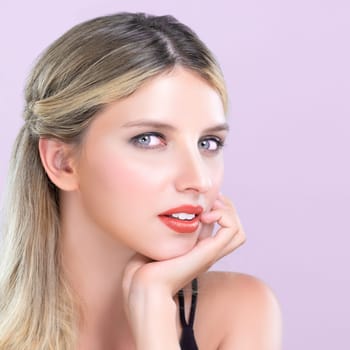 Closeup pretty beautiful woman with alluring perfect smooth and clean skin portrait in pink isolated background. Hand gesture with expressive facial expression for beauty model concept.