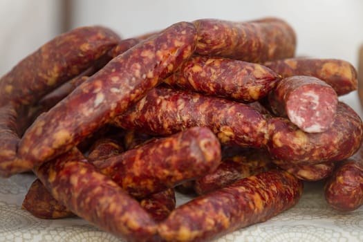 Fresh smoked sausage in the store. Choice of smoked meat products. Selection of sausages in the store