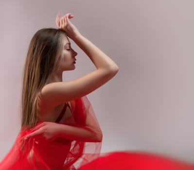 sexy girl with red transparent fabric on a white background copy paste