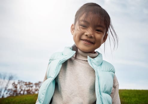 I like playing outdoors the most. an adorable little girl spending the day outdoors