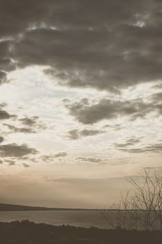 Abstract background sky Dawn Sunset Contrast dark shadow bright cloud sun orange silhouette above the mountains near the sea.