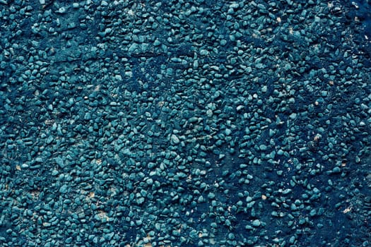 Texture of dark blue pebbles, abstract background of small stones
