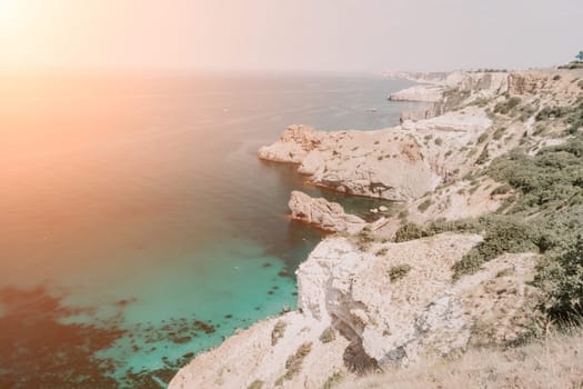 Aerial panoramic view of beautiful sunset above sea. Beautiful seascape. Sun glare, small waves on the water surface. Evening. Horizon. Nobody. No people. Copy space. Never-ending beauty of nature