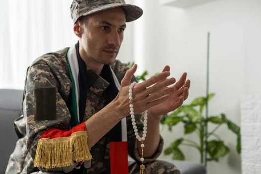 Soldier from United Arab Emirates with prayer beads.