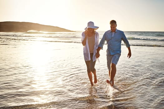 Saltwater makes the romance come alive. a mature couple spending the day at the beach