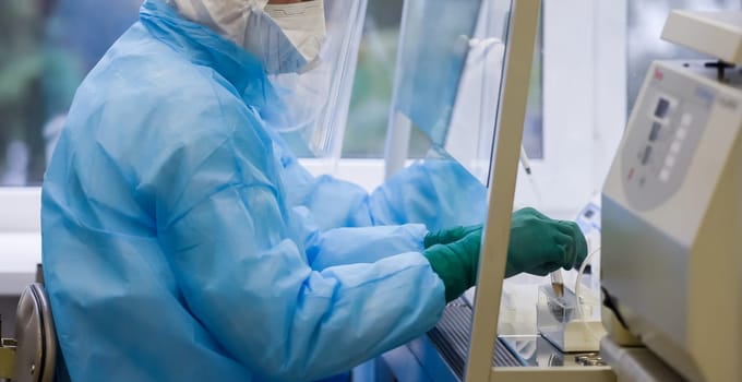 Laboratory for the study of tests for covid 19. Laboratory assistant checks samples for antibodies.