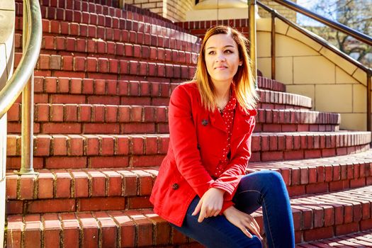 Young female college student relax on campus.